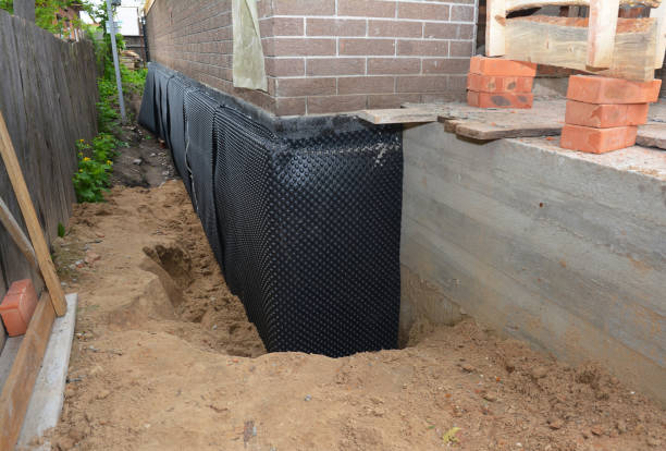 Happy homeowners after waterproofing job in Newcomb